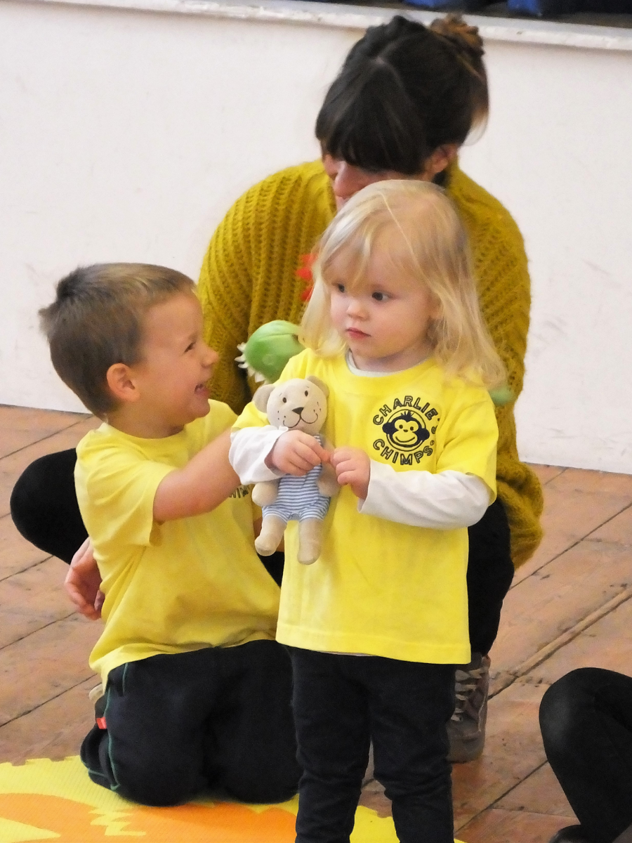 two kids wearing charlie chimps t shirts
