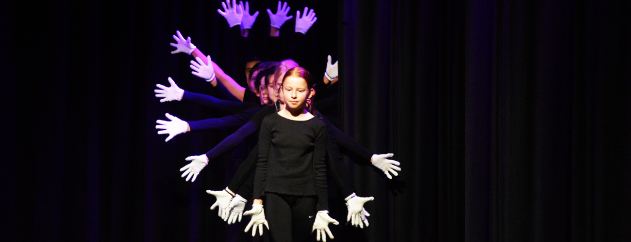 a group of students performing on stage