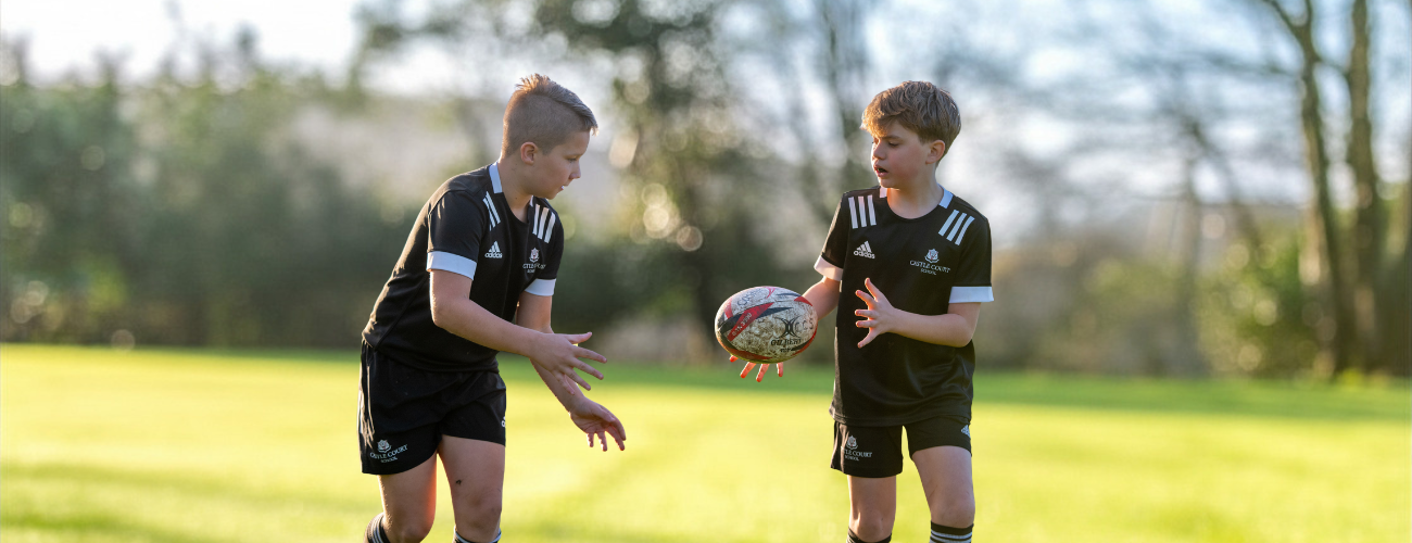 two students playing rugby