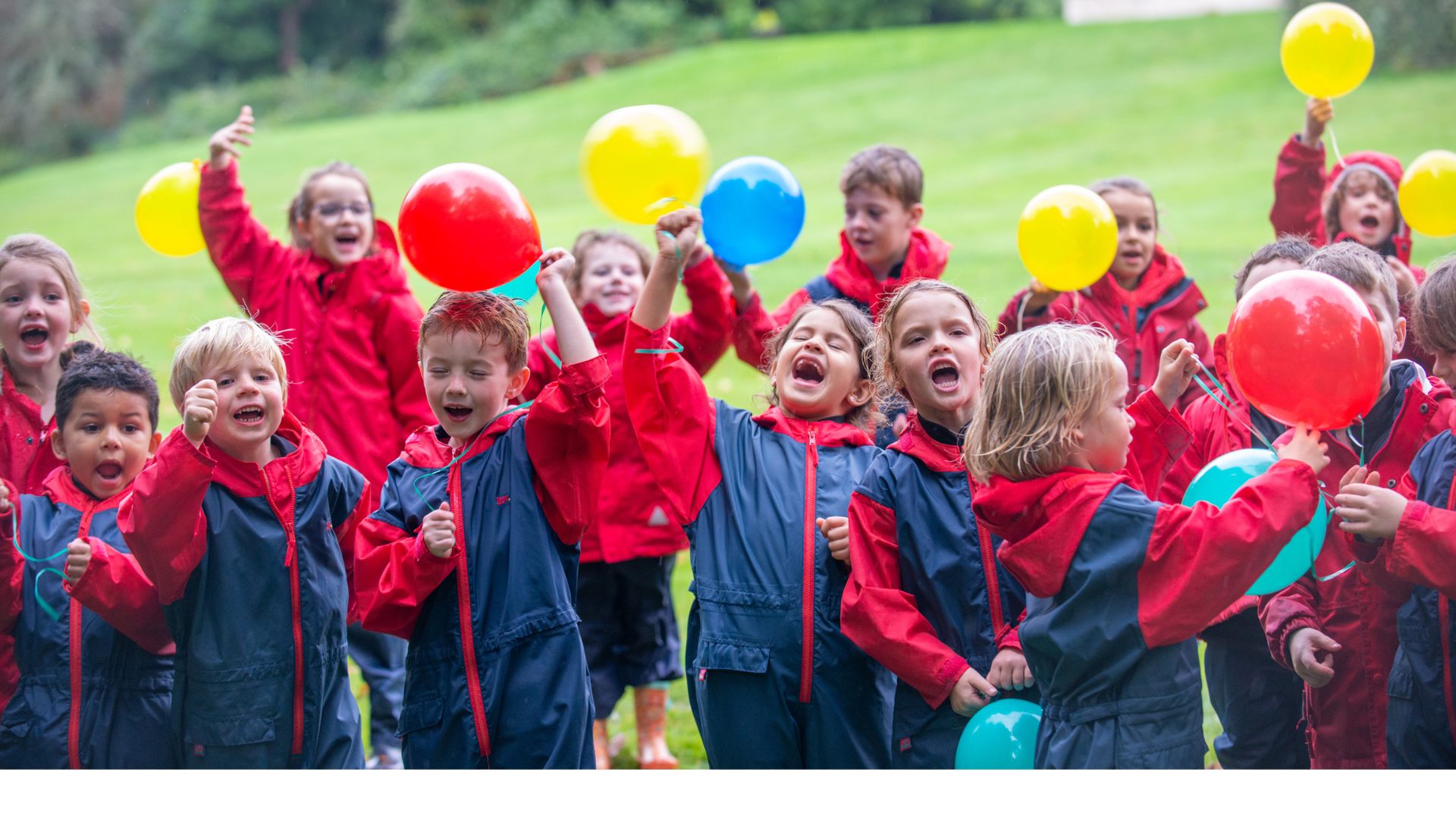 photo of a group of students holding balloons