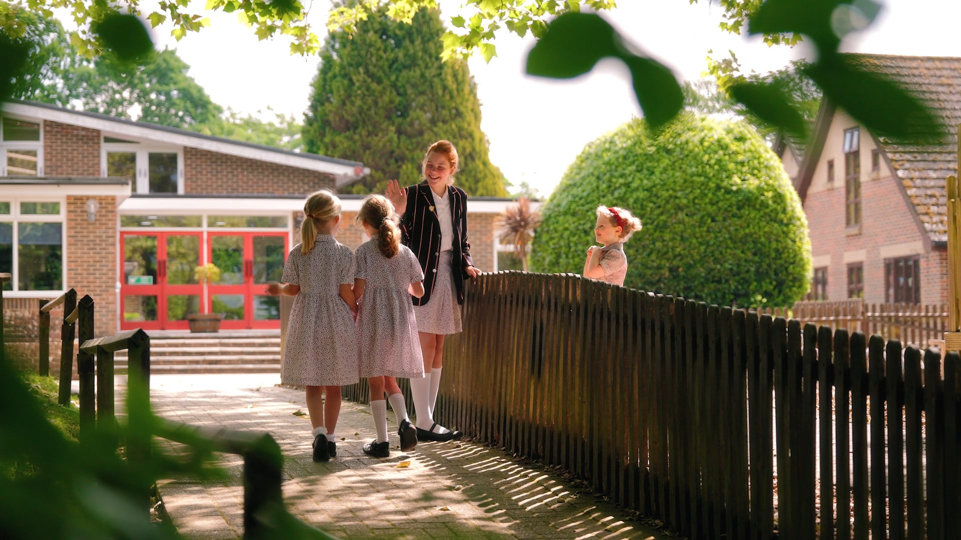 three students interacting at break time
